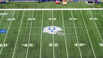 Feb 28, 2024; Indianapolis, IN, USA; The Indianapolis Colts helmet logo at midfield of Lucas Oil Stadium. Mandatory Credit: Kirby Lee-Imagn Images
