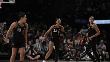 Sep 24, 2023; Las Vegas, Nevada, USA; Las Vegas Aces center A'ja Wilson (22), guard Kelsey Plum (10) and center Kiah Stokes (41) celebrate against the Dallas Wings during game one of the 2023 WNBA Semifinals at Michelob Ultra Arena. The Aces defeated the Wings 97-83. Mandatory Credit: Kirby Lee-Imagn Images