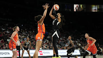 Jun 25, 2025; Las Vegas, Nevada, USA; Las Vegas Aces center A'ja Wilson (22) shoots the ball against Connecticut Sun center Olivia Nelson-Ododa (10) during the second half of a WNBA basketball game at Michelob Ultra Arena. 