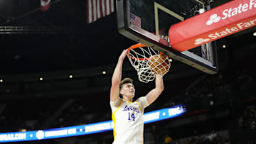 Jul 15, 2024; Las Vegas, NV, USA; Los Angeles Lakers center Colin Castleton (14) dunks the ball against the Boston Celtics during the first half at Thomas & Mack Center. Mandatory Credit: Lucas Peltier-USA TODAY Sports