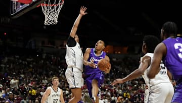 Jul 14, 2025; Las Vegas, NV, USA;  Utah Jazz forward John Tonje (17) drives towards the basket against San Antonio Spurs forward Carter Bryant (11) during the first half of a NBA basketball game at the Thomas & Mack Center.