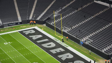 Nov 26, 2023; Paradise, Nevada, USA;  The words  End Racism  and Raiders logo in the end zone at Allegiant Stadium. Mandatory Credit: Kirby Lee-USA TODAY Sports