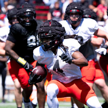 Cincinnati Bearcats wide receiver Tyrin Smith (4) runs the ball during the University of Cincinnati annual Red and Black Spring football game and practice at Nippert Stadium in Cincinnati on Saturday, April 13, 2024.