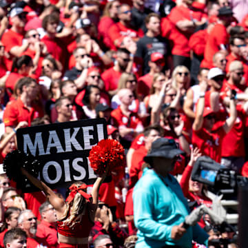 Cincinnati Bearcats cheerleader holds up a sign in the first quarter of the College Football game between the Cincinnati Bearcats and the Pittsburgh Panthers at Nippert Stadium in Cincinnati on Saturday, Sept. 7, 2024.