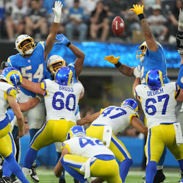 Aug 17, 2024; Inglewood, California, USA; Los Angeles Rams place kicker Joshua Karty (16) attempts a field goal against Los Angeles Chargers linebacker Savion Jackson (54) in the second half at SoFi Stadium. Mandatory Credit: Kirby Lee-Imagn Images