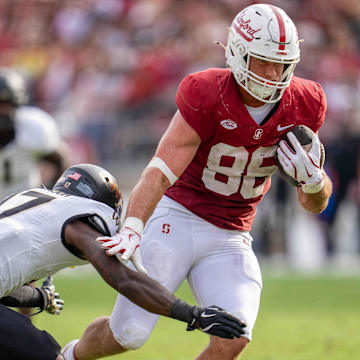 Oct 26, 2024; Stanford, California, USA;  Stanford Cardinal tight end Sam Roush (86) breaks a tackle by Wake Forest Demon Deacons defensive back Zamari Stevenson (17) during the fourth quarter at Stanford Stadium. Mandatory Credit: Neville E. Guard-Imagn Images