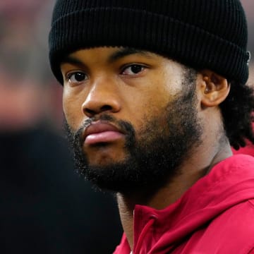 Cardinals quarterback Kyler Murray (1) on the sidelines in street clothes prior to a game against the Saints at State Farm Stadium in Glendale, Ariz., on Saturday, Aug. 10, 2024.