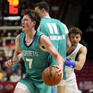 Jul 14, 2025; Las Vegas, NV, USA; Charlotte Hornets guard Kon Knueppel (7) controls the ball against the Dallas Mavericks during the second half of a NBA basketball game at the Thomas & Mack Center. Mandatory Credit: Lucas Peltier-Imagn Images