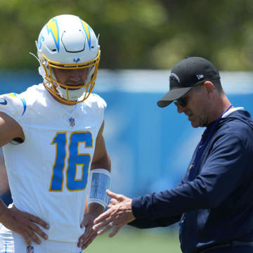 May 29, 2024; Costa Mesa, CA, USA; Los Angeles Chargers quarterback Casey Bauman (16) and coach Jim Harbaugh during organized team activities at Hoag Performance Center. Mandatory Credit: Kirby Lee-USA TODAY Sports