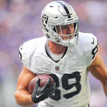 Aug 10, 2024; Minneapolis, Minnesota, USA; Las Vegas Raiders tight end Brock Bowers (89) runs after the catch against the Minnesota Vikings in the first quarter at U.S. Bank Stadium. Mandatory Credit: Brad Rempel-Imagn Images