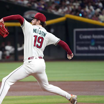 May 26, 2025; Phoenix, Arizona, USA; Arizona Diamondbacks pitcher Ryne Nelson (19) pitches against the Pittsburgh Pirates during the first inning at Chase Field. Mandatory Credit: Joe Camporeale-Imagn Images