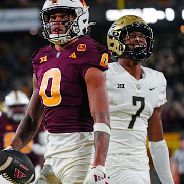 ASU wide receiver Jordyn Tyson (0) celebrates a touchdown catch against UCF defensive back Antione Jackson (7) during a game at Mountain America Stadium in Tempe on Nov. 9, 2024.