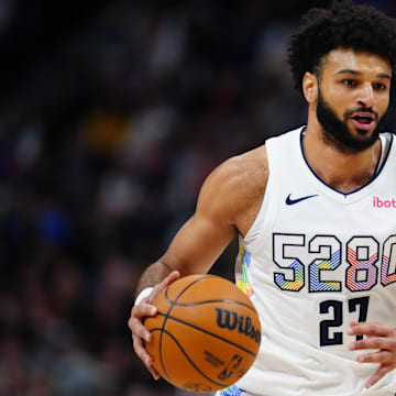 Nov 25, 2024; Denver, Colorado, USA; Denver Nuggets guard Jamal Murray (27) dribbles the ball in the first quarter against the New York Knicks at Ball Arena. Mandatory Credit: Ron Chenoy-Imagn Images