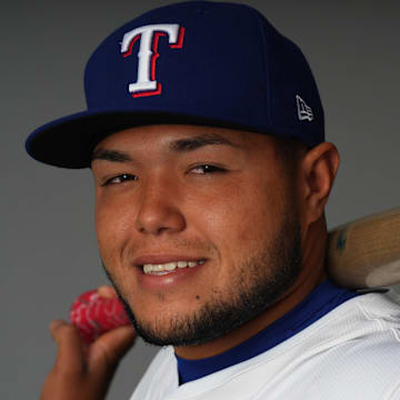 Feb 20, 2024; Surprise, AZ, USA; Texas Rangers infielder Abimelec Ortiz poses for a photo during Media Day at Surprise Stadium. 