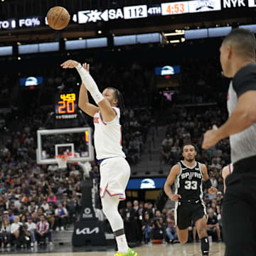 ; New York Knicks guard Jalen Brunson (11) shoots over San Antonio Spurs forward Victor Wembanyama (1) during the second half at Frost Bank Center. Mandatory Credit: Scott Wachter-Imagn Images