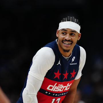 Mar 15, 2025; Denver, Colorado, USA; Washington Wizards guard Jordan Poole (13) reacts back towards the Denver Nuggets bench in the first quarter at Ball Arena. Mandatory Credit: Ron Chenoy-Imagn Images
