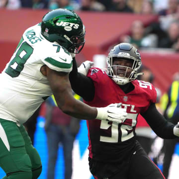 Oct 10, 2021; London, England, United Kingdom; Atlanta Falcons linebacker Adetokunbo Ogundeji (92) tries to get past New York Jets offensive tackle Morgan Moses (78) in the second half during an NFL International Series game at Tottenham Hotspur Stadium. The Falcons defeated the Jets 27-20.
