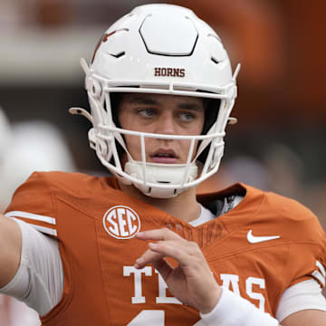 Texas Longhorns quarterback Arch Manning (16) warms up before a game against the Vanderbilt Commodores at Darrell K Royal-Texas Memorial Stadium. 
