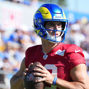 Jul 23, 2025; Los Angeles, CA, USA; Los Angeles Rams quarterback Stetson Bennett (13) throws the ball during training camp at Loyola Marymount University. Mandatory Credit: Kirby Lee-Imagn Images
