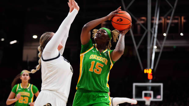 Oregon Ducks center Phillipina Kyei (15) shoots the ball at Colorado Buffaloes 