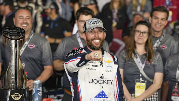 NASCAR Cup Series driver Ross Chastain shows off his diamond ring for winning the Coca Cola 600 at Charlotte Motor Speedway.