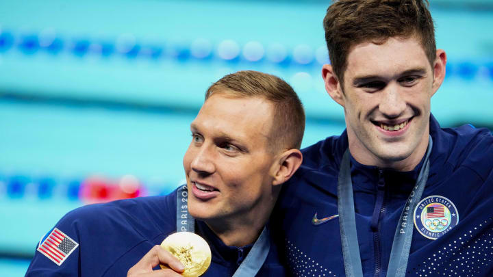 Jul 27, 2024; Nanterre, France; Caeleb Dressel (USA) and Hunter Armstrong (USA) in the men’s 4 x 100-meter freestyle relay medal ceremony during the Paris 2024 Olympic Summer Games at Paris La Défense Arena. Mandatory Credit: Rob Schumacher-USA TODAY Sports