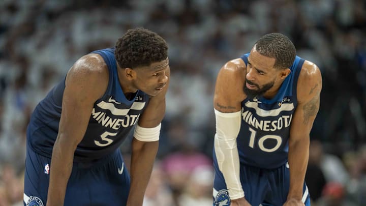May 14, 2025; Minneapolis, Minnesota, USA; Minnesota Timberwolves guard Anthony Edwards (5) looks on with Minnesota Timberwolves guard Mike Conley (10) against the Golden State Warriors in the first half during game five of the second round for the 2025 NBA Playoffs at Target Center. Mandatory Credit: Jesse Johnson-Imagn Images