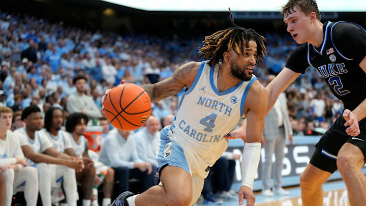 Mar 8, 2025; Chapel Hill, North Carolina, USA;  North Carolina Tar Heels guard RJ Davis (4) with the ball as Duke Blue Devils forward Cooper Flagg (2) defends.