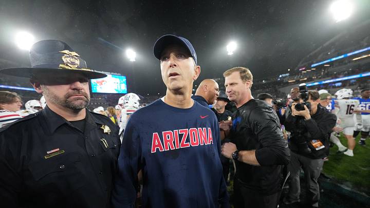 Jan 2, 2026; San Diego, CA, USA; Arizona Wildcats head coach Brent Brennan reacts after shaking hands with SMU Mustangs head coach Rhett Lashlee in the Holiday Bowl at Snapdragon Stadium. Mandatory Credit: Kirby Lee-Imagn Images