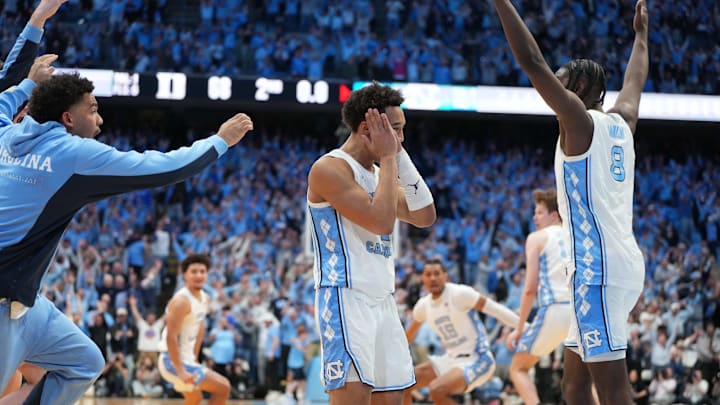 Feb 7, 2026; Chapel Hill, North Carolina, USA; North Carolina Tar Heels guard Seth Trimble (7) and teammates react after hitting the game winning shot in the second  half at Dean E. Smith Center. Mandatory Credit: Bob Donnan-Imagn Images