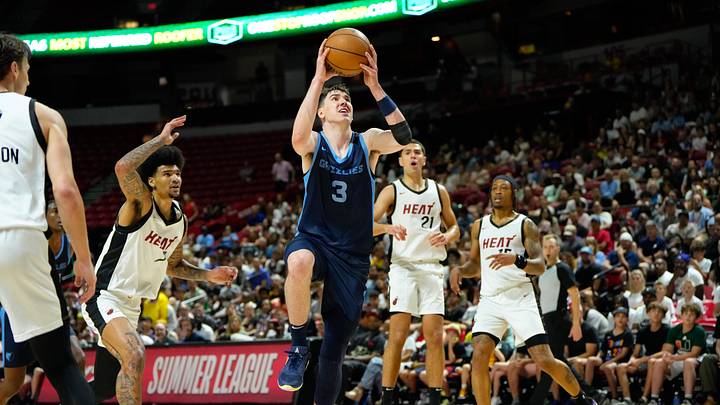 Jul 22, 2024; Las Vegas, NV, USA; Memphis Grizzlies forward Jake LaRavia (3) attempts to score a layup against the Miami Heat during the second half at Thomas & Mack Center. Mandatory Credit: Lucas Peltier-Imagn Images
