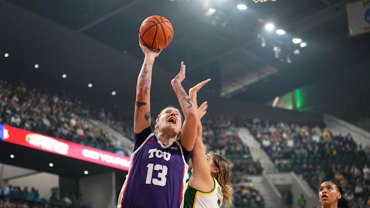 Jan 3, 2024; Waco, Texas, USA;  TCU Horned Frogs forward Sedona Prince (13) scores a basket against Baylor Lady Bears forward Madison Bartley (3) during the first half at Paul and Alejandra Foster Pavilion. Mandatory Credit: Chris Jones-Imagn Images