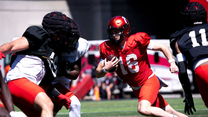 Cincinnati Bearcats quarterback Brady Lichtenberg (16) runs with the ball during the University of Cincinnati annual Red and Black Spring football game and practice at Nippert Stadium in Cincinnati on Saturday, April 13, 2024.