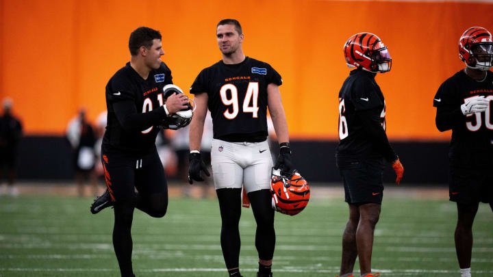 Cincinnati Bengals defensive end Sam Hubbard (94) speaks with Cincinnati Bengals defensive end Trey Hendrickson (91) at Bengals spring practice at the IEL Indoor Facility in Cincinnati on Wednesday, June 12, 2024.