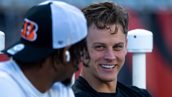 Cincinnati Bengals quarterback Joe Burrow (9) smiles while speaking with Cincinnati Bengals wide receiver Ja'Marr Chase (1) before stretching for the NFL game between the Cincinnati Bengals and Los Angeles Rams at Paycor Stadium in Cincinnati on Monday, Sept. 25, 2023.