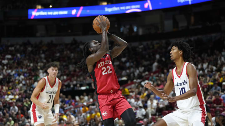 Jul 12, 2024; Las Vegas, NV, USA;  Atlanta Hawks guard Keaton Wallace (22) shoots the ball against Washington Wizards forward John Butler Jr. (19) during the first half at Thomas & Mack Center. Mandatory Credit: Lucas Peltier-USA TODAY Sports