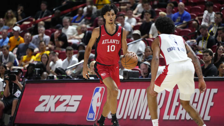 Jul 12, 2024; Las Vegas, NV, USA;  Atlanta Hawks forward Zaccharie Risacher (10) dribbles the ball against Washington Wizards forward Justin Champagnie (9) during the first half at Thomas & Mack Center. Mandatory Credit: Lucas Peltier-USA TODAY Sports