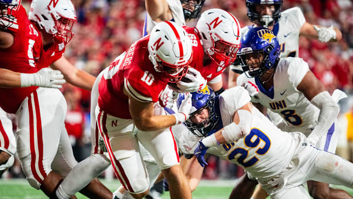 Sep 14, 2024; Lincoln, Nebraska, USA; Nebraska Cornhuskers quarterback Heinrich Haarberg (10) runs against Northern Iowa Panthers linebacker Tucker Langenberg (29) during the third quarter at Memorial Stadium.