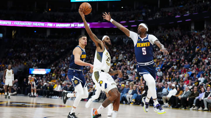Jan 14, 2024; Denver, Colorado, USA; Denver Nuggets guard Kentavious Caldwell-Pope (5) defends on Indiana Pacers forward Isaiah Jackson (22) in the second half at Ball Arena. Mandatory Credit: Ron Chenoy-USA TODAY Sports