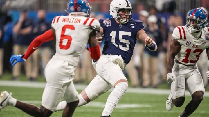 Penn State quarterback Drew Allar runs with the ball against the Mississippi Rebels during the second half of the Peach Bowl at Mercedes-Benz Stadium in Atlanta. 