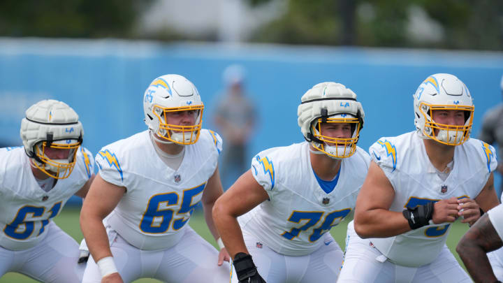 Jun 13, 2024; Costa Mesa, CA, USA; Los Angeles Chargers guard Karsen Barnhart (61), center Brent Laing (65), offensive tackle Joe Alt (76) and offensive tackle Foster Sarell (73) during minicamp at the Hoag Performance Center. Mandatory Credit: Kirby Lee-USA TODAY Sports