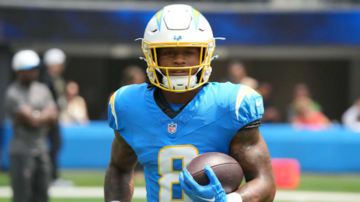 Los Angeles Chargers running back Omarion Hampton carries the ball before the game against the New Orleans Saints.