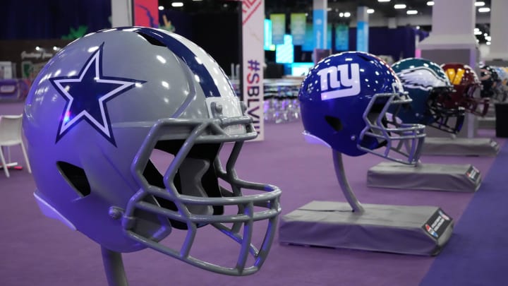 Feb 9, 2024; Las Vegas, NV, USA; Large Dallas Cowboys and New York Giants helmets at the NFL Experience at the Mandalay Bay South Convention Center.  