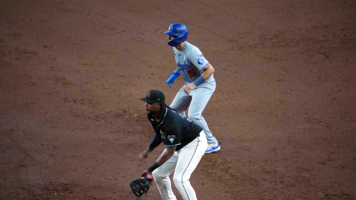 Sep 1, 2024; Phoenix, Arizona, USA; Los Angeles Dodgers catcher Austin Barnes (15) leads off first as Arizona Diamondbacks first base Josh Bell (36) covers the bag during the sixth inning at Chase Field. Mandatory Credit: Joe Camporeale-USA TODAY Sports