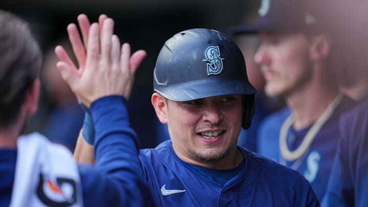 Seattle Mariners third baseman Luis Urias (16) celebrates his run against the Minnesota Twins in the second inning at Target Field on May 7.