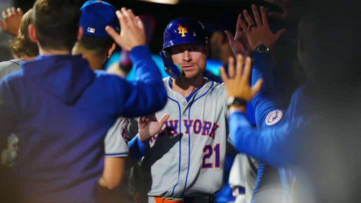 Aug 7, 2024; Denver, Colorado, USA; New York Mets outfielder Ben Gamel (21) celebrates scoring a run in the ninth inning against the Colorado Rockies at Coors Field. Mandatory Credit: Ron Chenoy-USA TODAY Sports