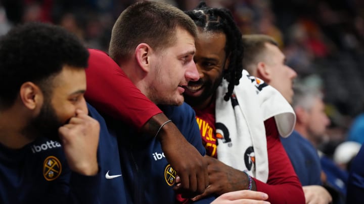 Dec 28, 2023; Denver, Colorado, USA; Denver Nuggets center DeAndre Jordan (6) and center Nikola Jokic (15) reacts on the bench in the second half against the Memphis Grizzlies at Ball Arena. Mandatory Credit: Ron Chenoy-USA TODAY Sports