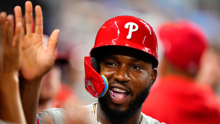 Aug 2, 2023; Miami, Florida, USA; Philadelphia Phillies shortstop Rodolfo Castro (29) celebrates with teammates after scoring against the Miami Marlins during the eleventh inning at loanDepot Park