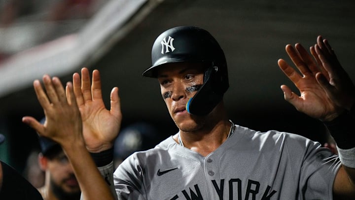 New York Yankees outfielder Aaron Judge (99) celebrates after scoring on a wild pitch to take the lead in the 11th inning of the MLB interleague game between the Cincinnati Reds and the New York Yankees at Great American Ball Park in downtown Cincinnati on Tuesday, June 24, 2025. The Reds won 5-4 in 11 innings. New York Yankees outfielder Aaron Judge (99) celebrates after scoring on a wild pitch to take the lead in the 11th inning of the MLB interleague game between the Cincinnati Reds and the New York Yankees at Great American Ball Park in downtown Cincinnati on Tuesday, June 24, 2025. The Reds won 5-4 in 11 innings.
