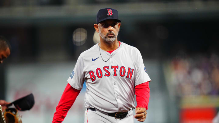 Jul 23, 2024; Denver, Colorado, USA; Boston Red Sox manager Alex Cora (13) leaves the field in the seventh inning against the Colorado Rockies at Coors Field. Mandatory Credit: Ron Chenoy-USA TODAY Sports